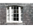Camber-headed Wyatt window on slate-hung façade, Cork